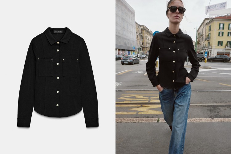 這款黑色合身翻領襯衫以俐落剪裁展現極簡高級感，凸顯腰線比例。金屬按扣與假鈕扣設計增添質感細節，平衡女性的柔美與幹練。