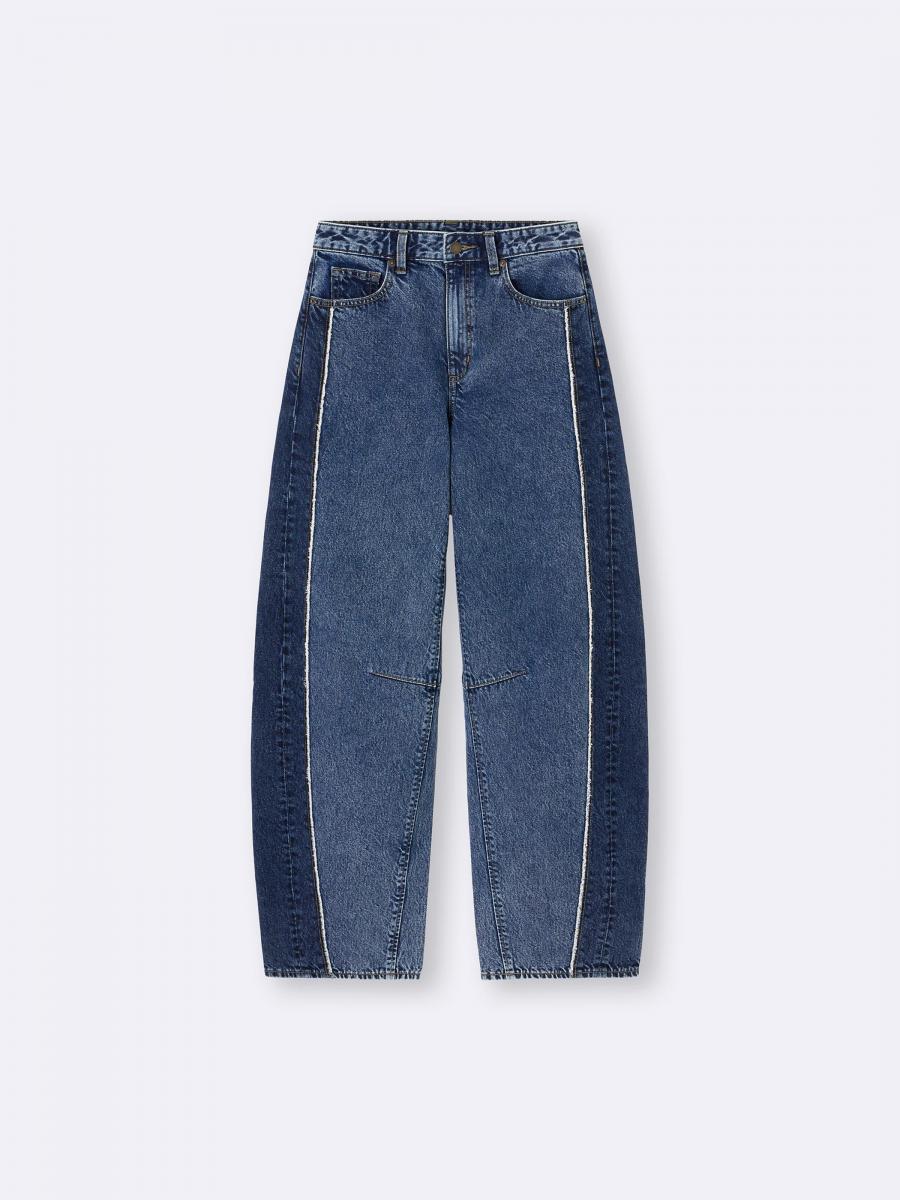 平價品牌 GU，則是運用撞色的牛在布料為軸心，藉由拼接線的設計，呈現出繭型褲獨特的曲線。