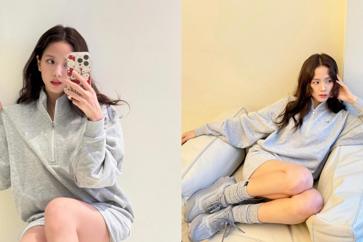 這套灰色系運動套裝，以寬鬆立領上衣搭配短褲，打造隨性又俐落的居家運動風。上衣半開襟設計增添層次細節，微微立領更顯清爽精神。